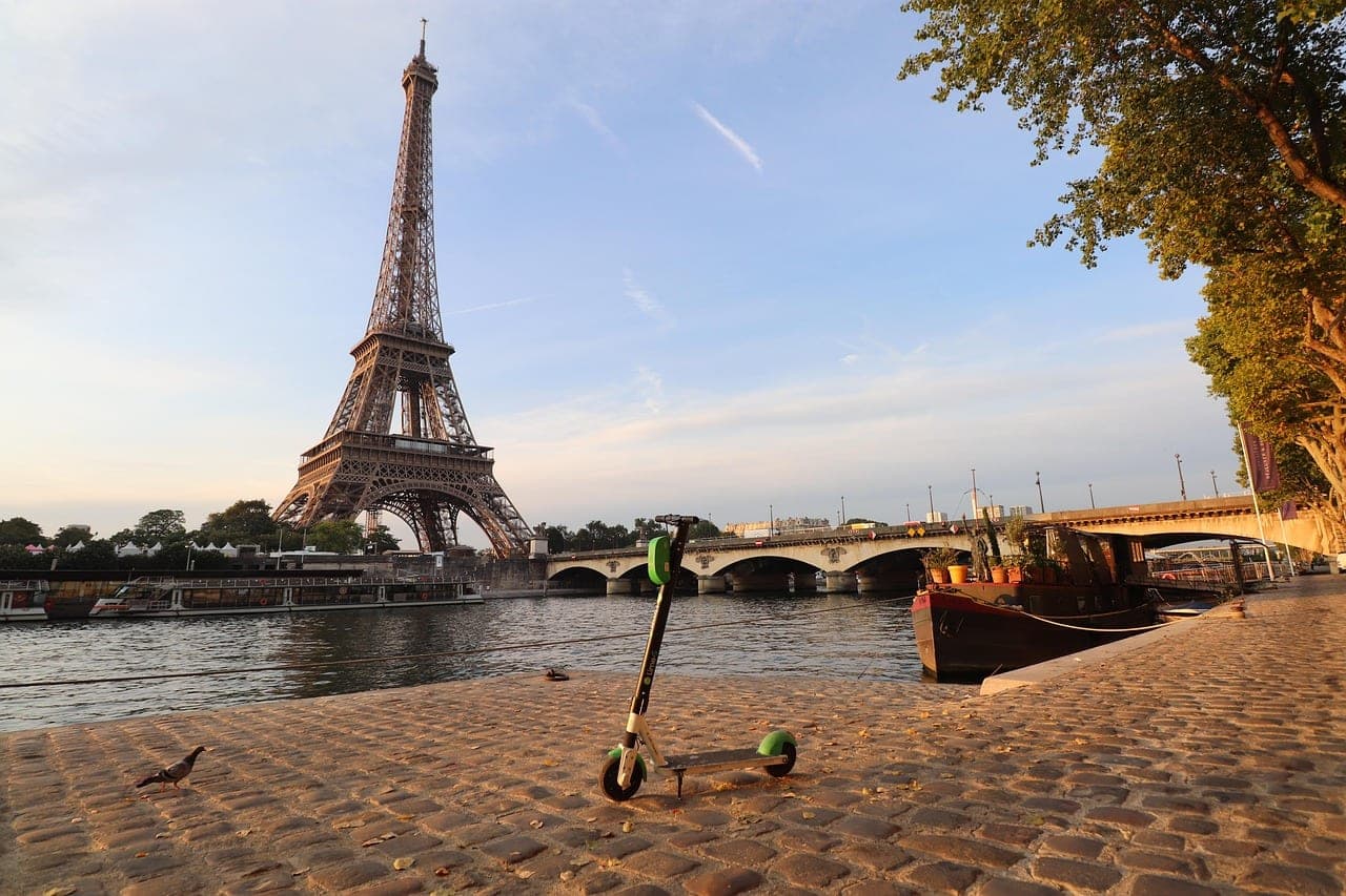 Eiffel Tower rising above the Seine with Paris cityscape at golden hour