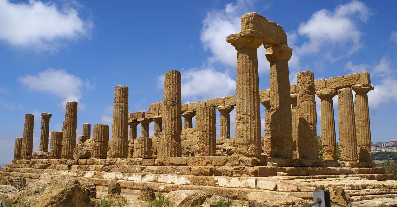 Greek temples of the Valley of the Temples at Agrigento lit by Sicilian sunset