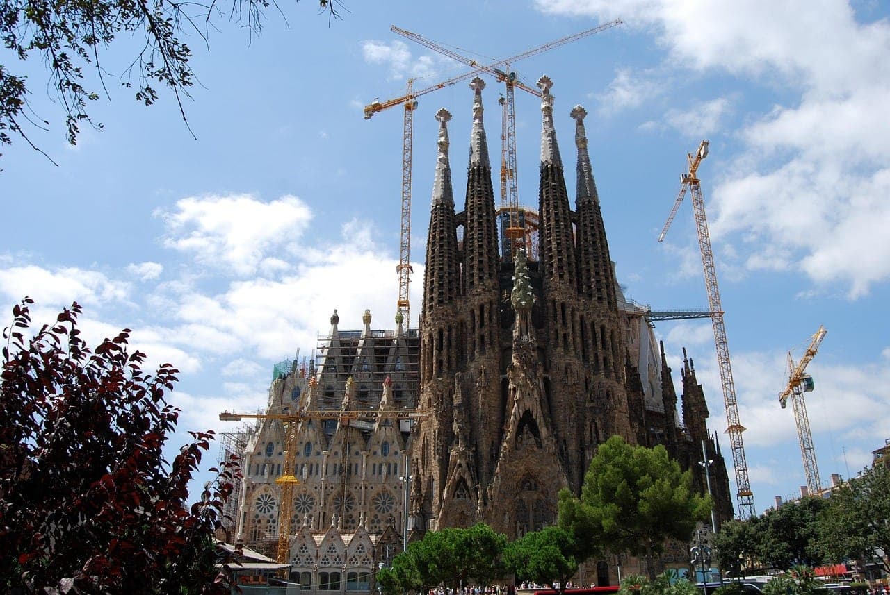 Gaudí's Sagrada Família spires rising above the rooftops of Barcelona, Spain