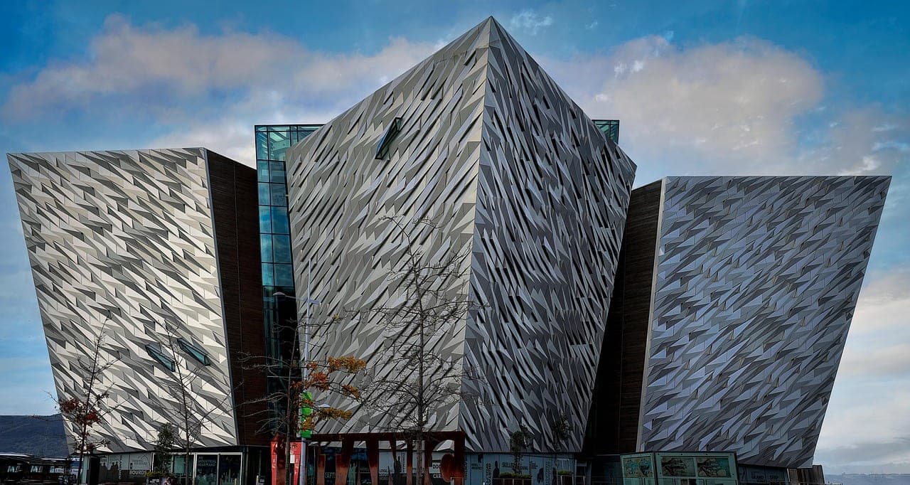 Titanic Belfast building and shipyard cranes along the River Lagan in Belfast, Northern Ireland