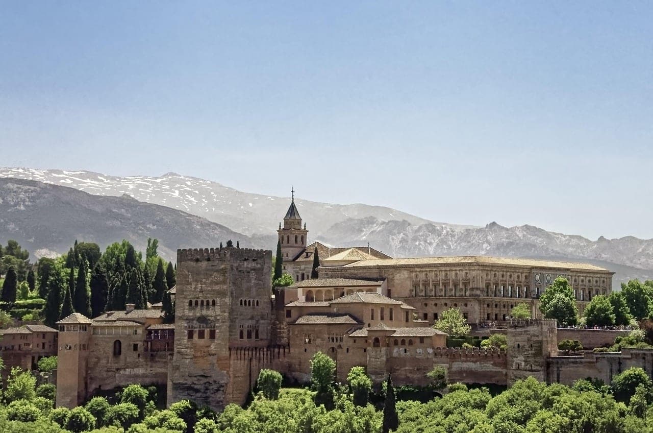 The Alhambra palace walls with the Sierra Nevada mountains rising behind Granada