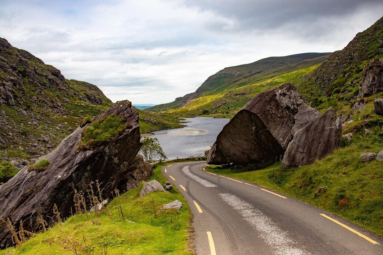 Lakes of Killarney with the MacGillycuddy's Reeks rising above ancient oak woodland in County Kerry