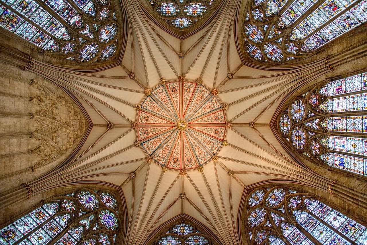 Gothic west front of York Minster cathedral towering over the medieval city of York, England